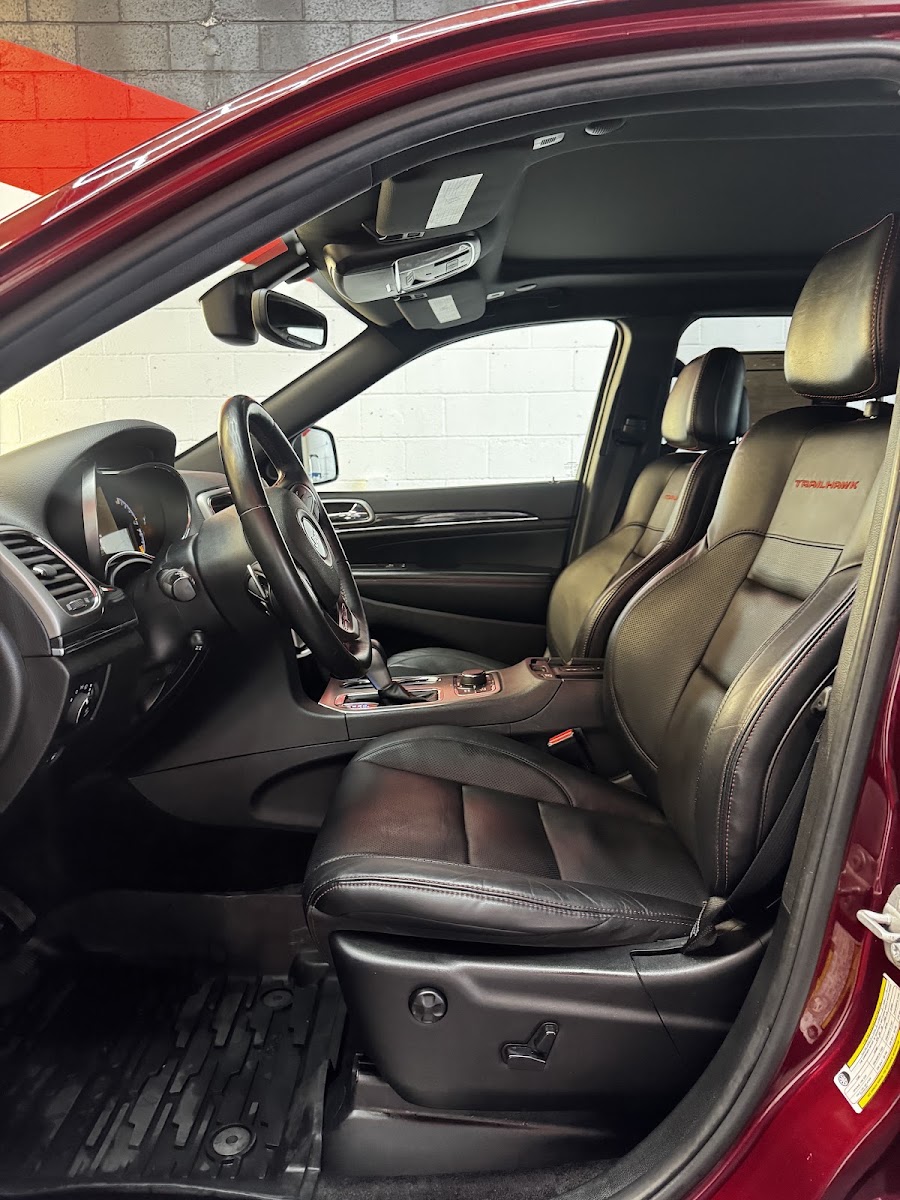 Detailed leather interior of a red SUV