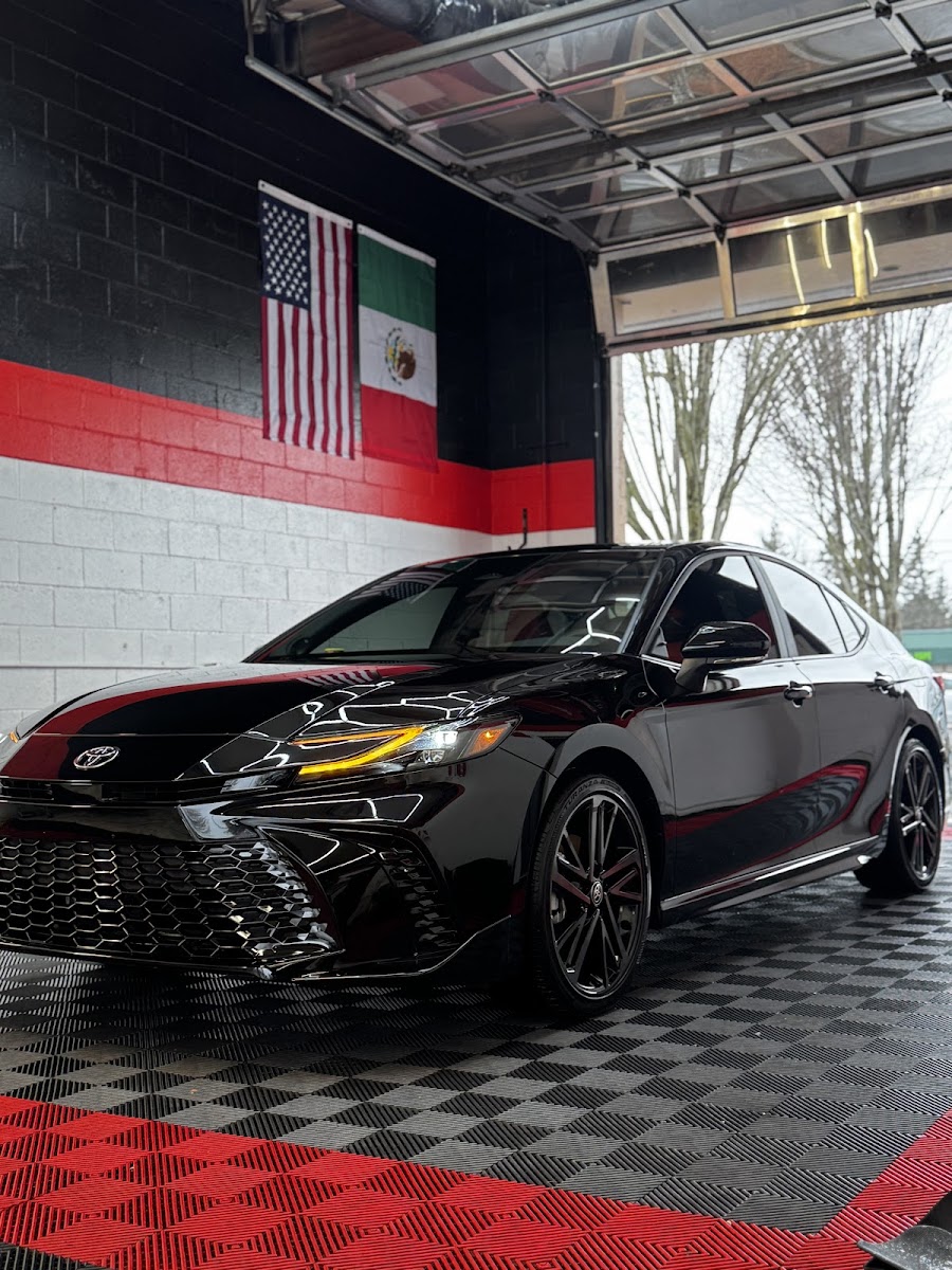 Glossy black sedan after a full detail