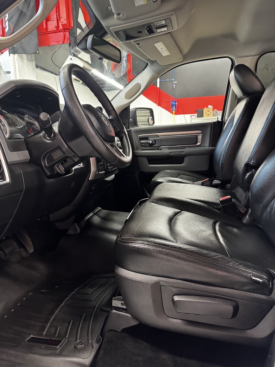 Clean leather front seats of a pickup truck